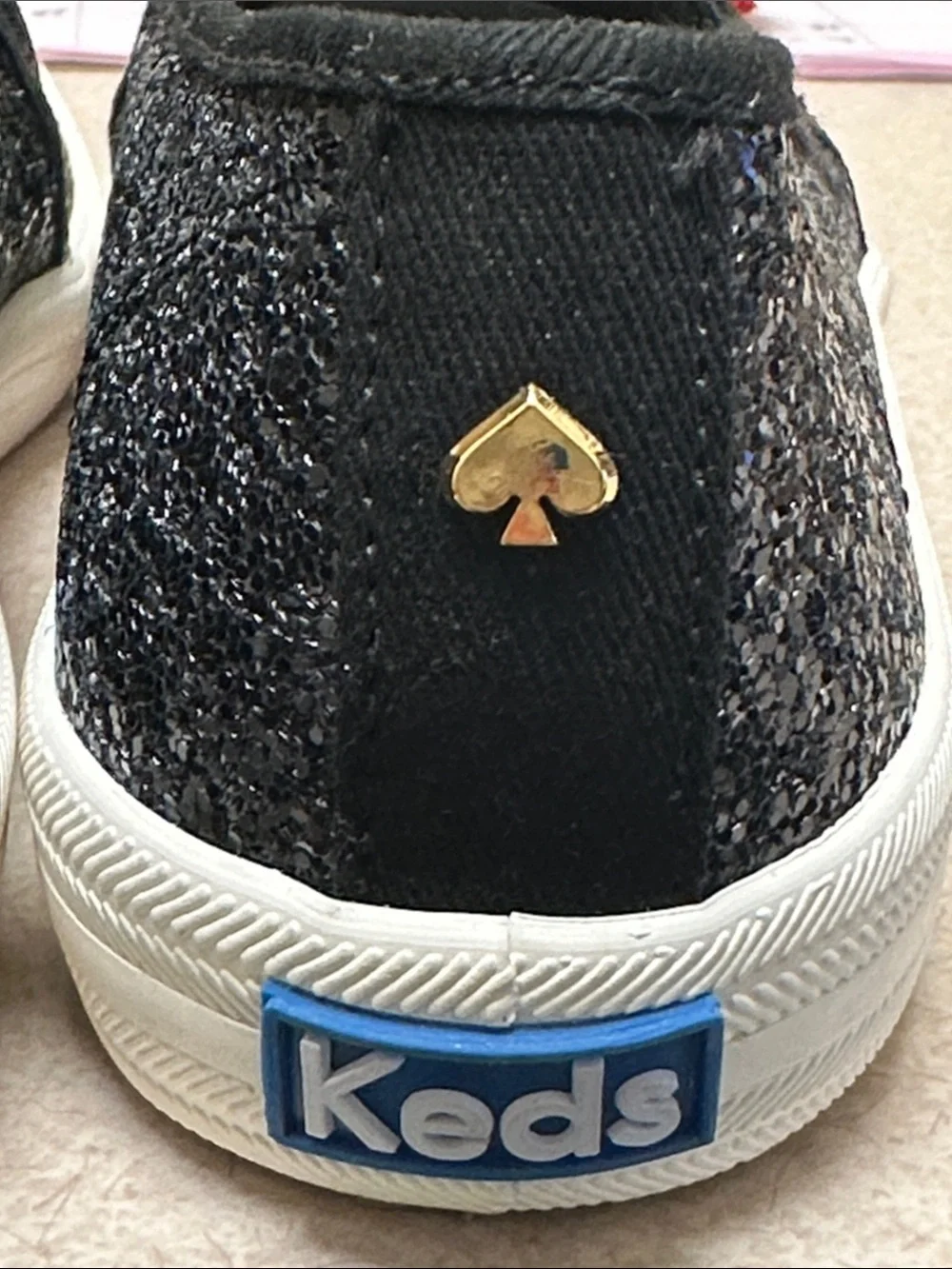 kate spade black glitter slip-on sneakers with white sole